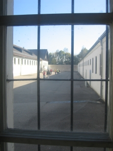 Looking through the bars onto the courtyard outside the bunker